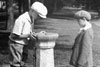 kids at a drinking fountain kids at a drinking fountain