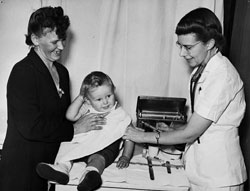 A nurse is about to inject a baby A nurse is about to inject a baby