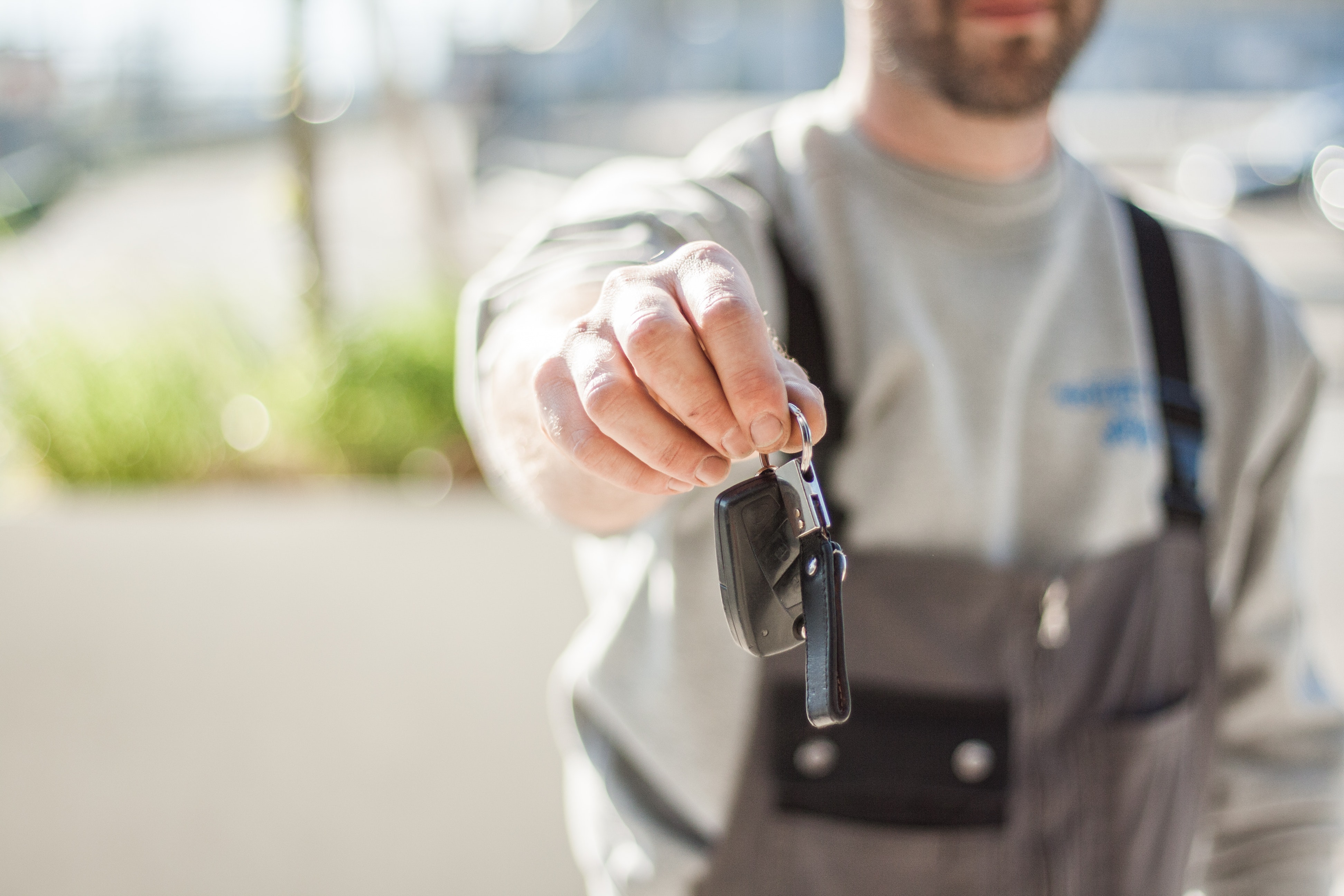 person holding car keys